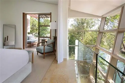 Спальня Wellness Suite в отеле Rosewood Mayakoba Спальня Wellness Suite в отеле Rosewood Mayakoba