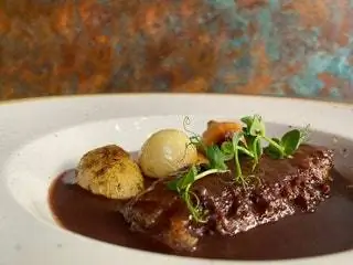 Rabo de la Vega с жареными каштанами в Distrito Vegano Rabo de la Vega с жареными каштанами в Distrito Vegano