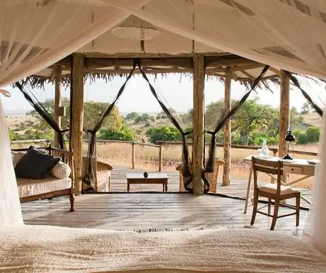 Дом Мкомбес, Танзания